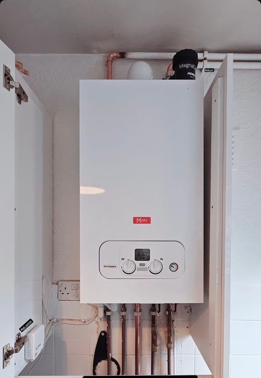 Baxi Eco Compact combi boiler installed in a kitchen cupboard